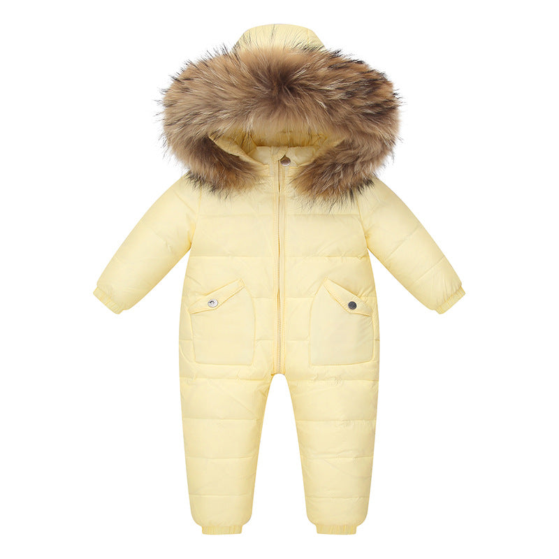 The Baby Wears White Eiderdown Over A Onesie And Down Jacket
